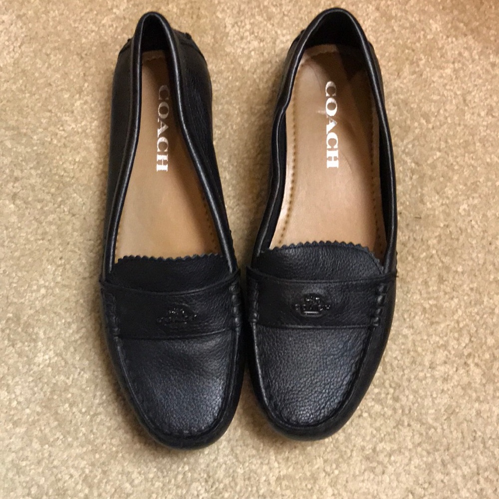 Black leather coach flats